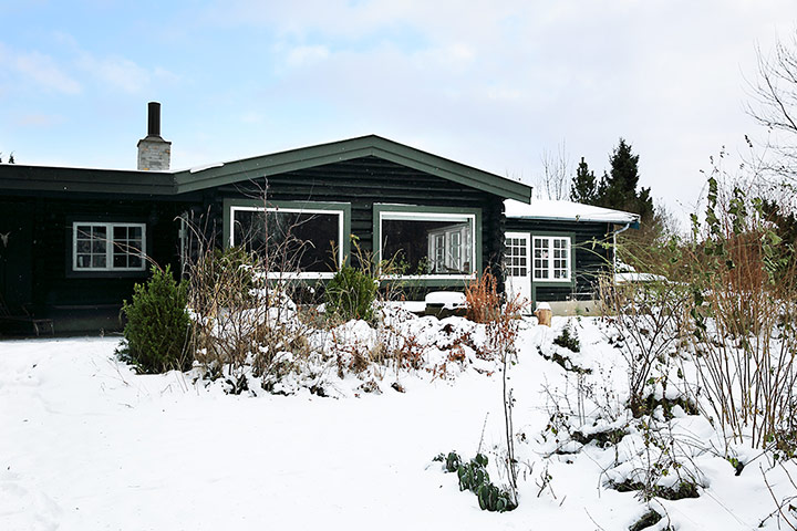 Exterior of house with snow in foreground
