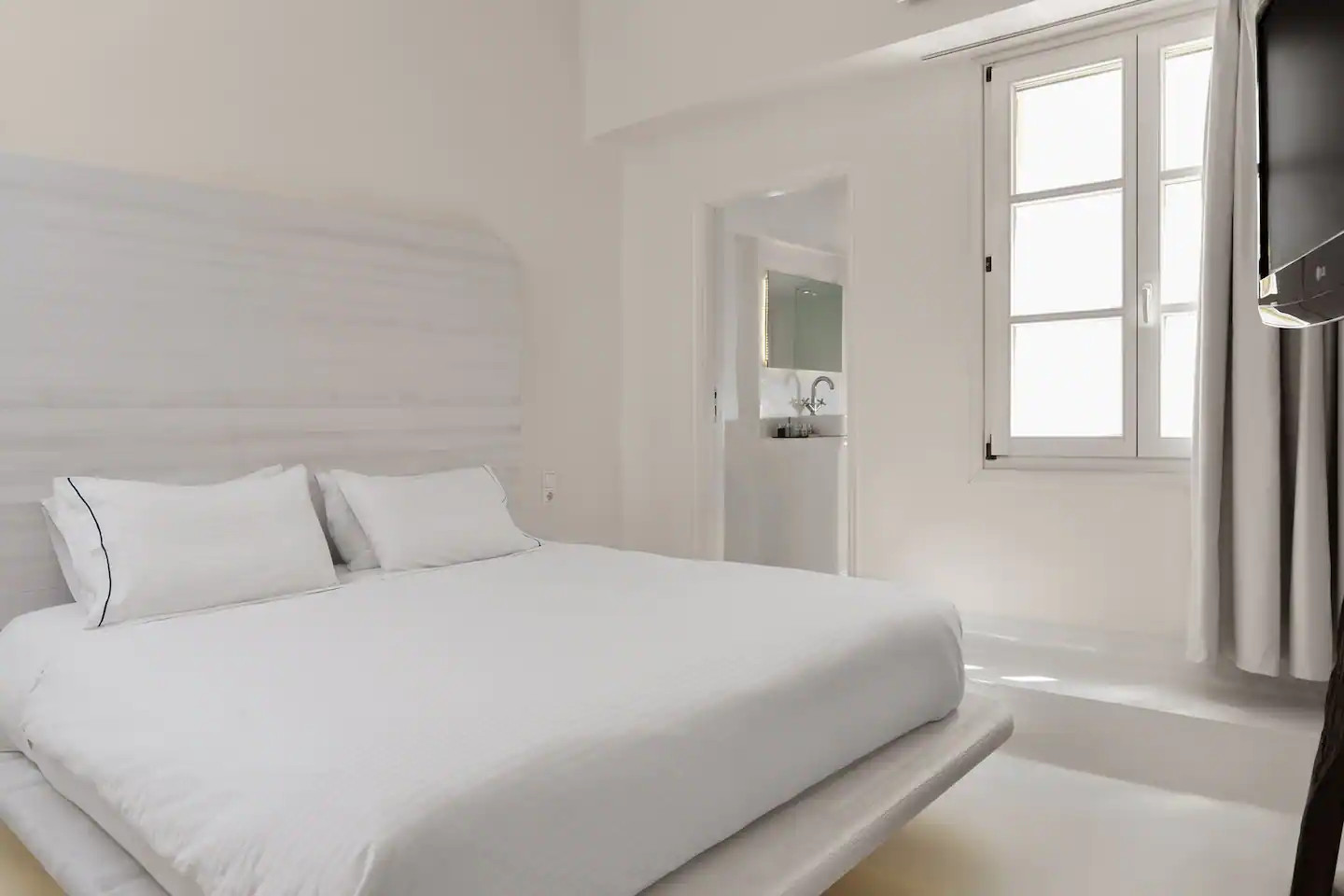 chambre design maison blanche à Mykonos