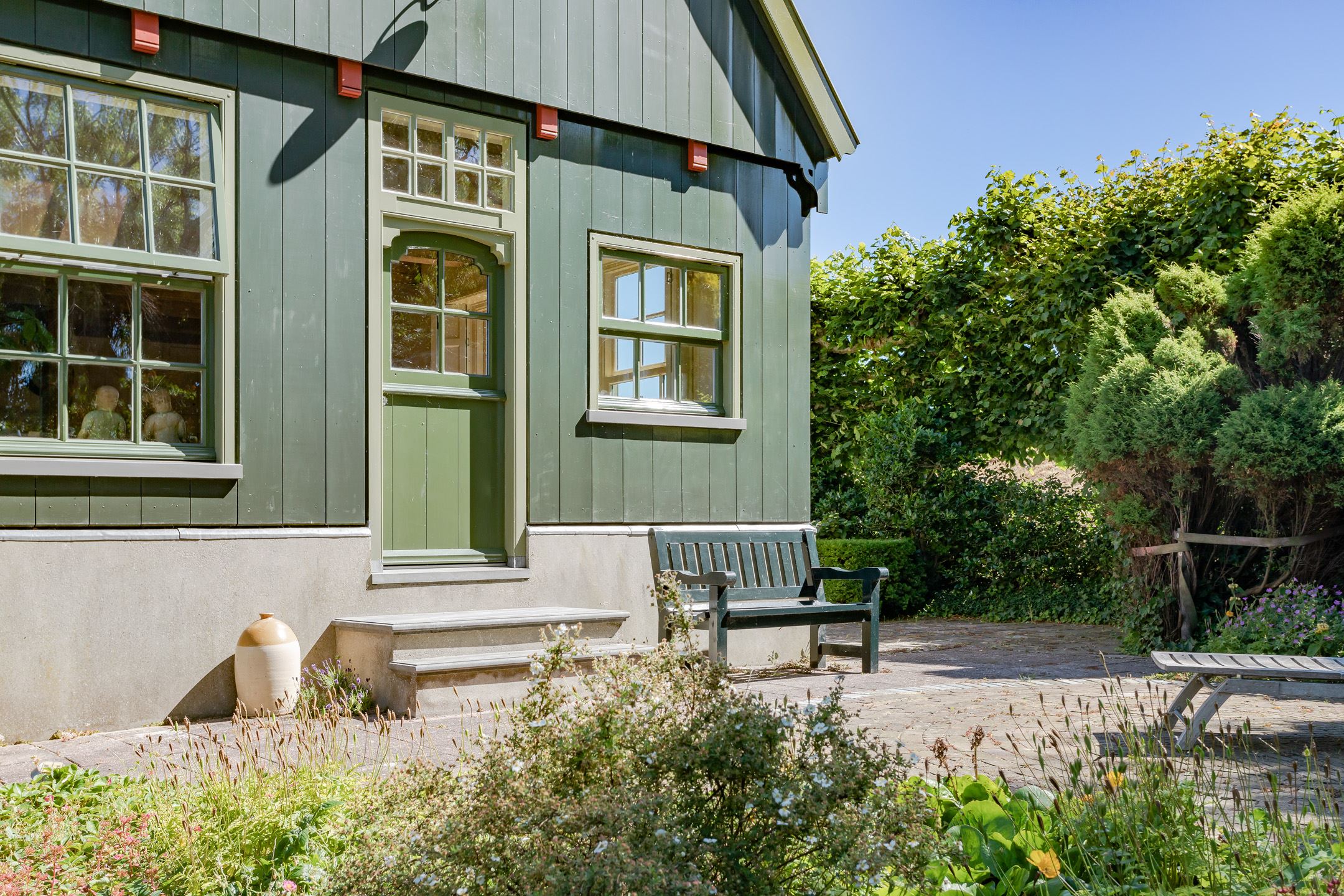 ferme rénovée façade bois vert