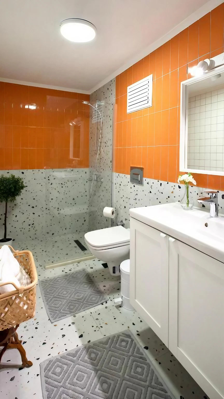 salle de bain terrazzo murs orange Nubu House Turquie