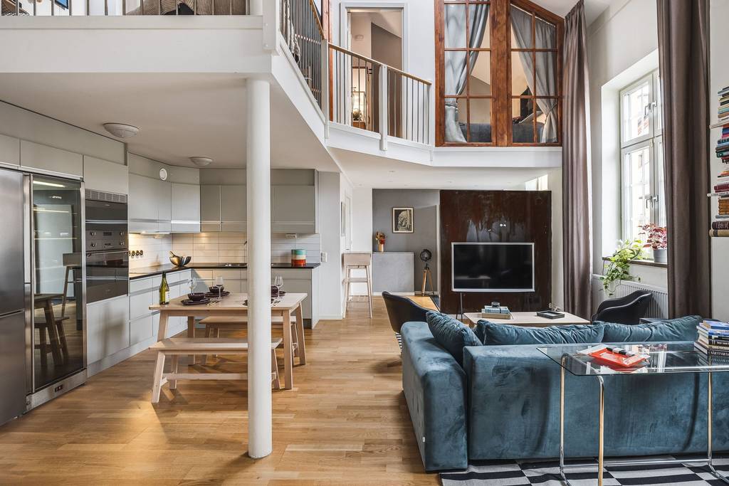 salon avec canapé bleu duplex 108m2
