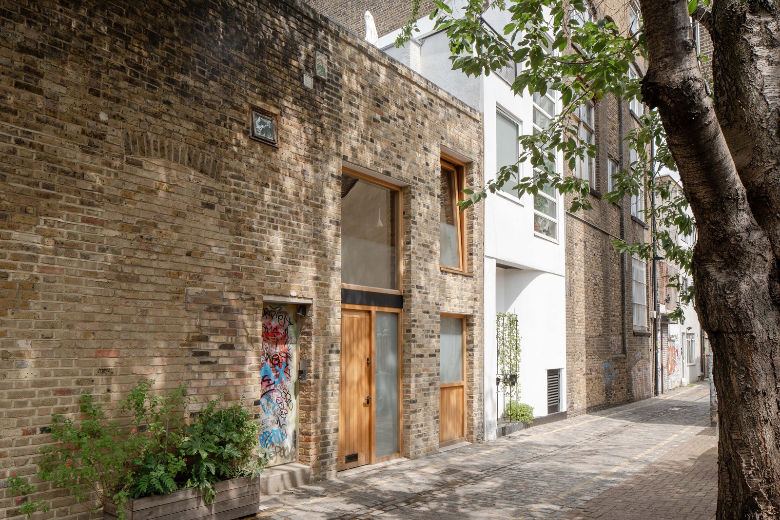petite maison de ville accolée façade briques Londres petite maison de ville accolée façade briques Londres