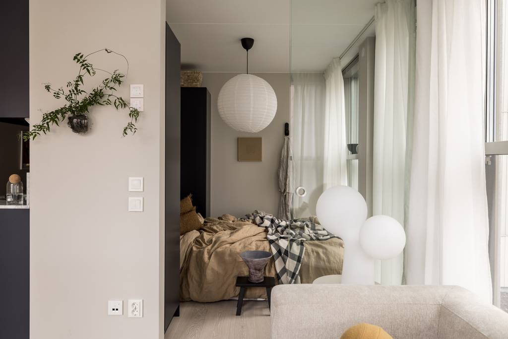 chambre et salon avec baies vitrées deux-pièces 34m2 décoration beige