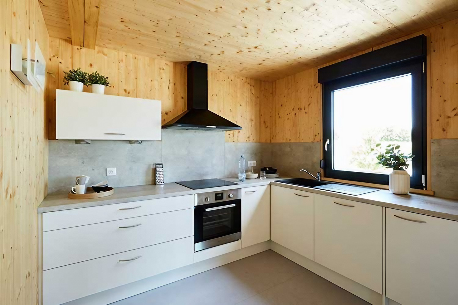 cuisine blanche design petite maison 50m2 en bois en Alsace par Hédonia cuisine blanche design petite maison 50m2 en bois en Alsace par Hédonia