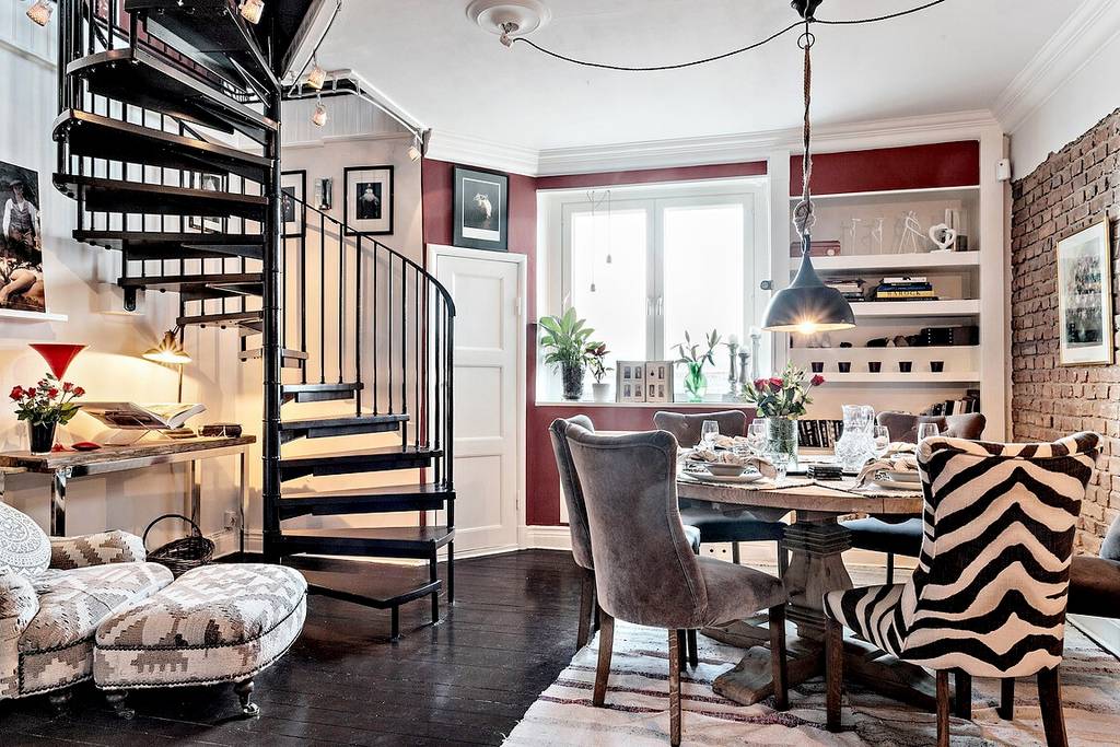salle à manger avec escalier en colimaçon appartement en triplex décoration scandinave et classique chic