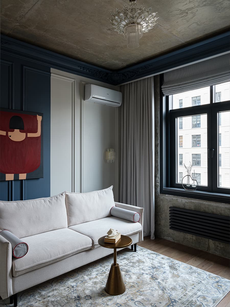salon murs bleus plafond béton deux-pièces de 41m2 décoration contemporaine