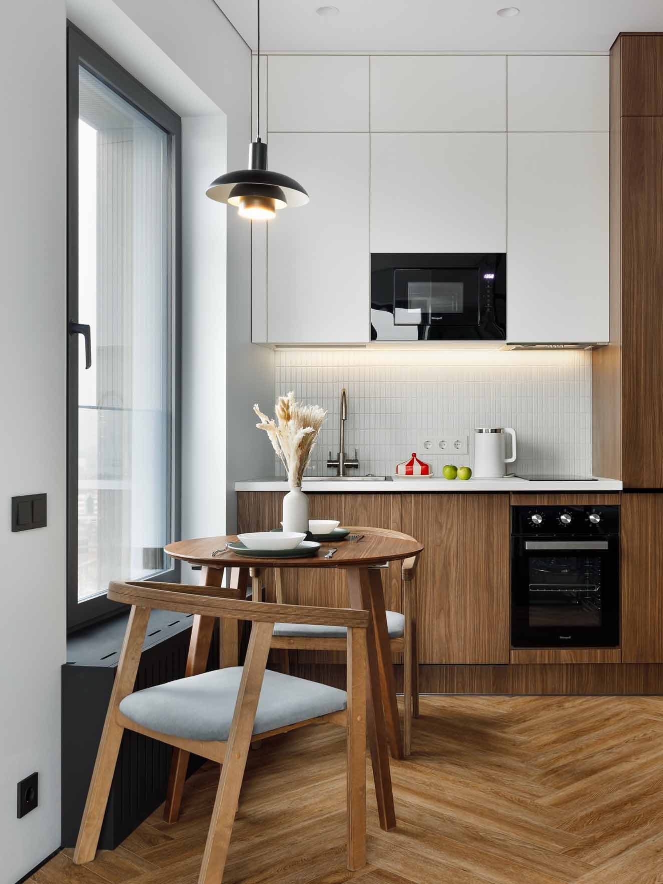 cuisine blanche et noyer et salle à manger noyer studio 27m2