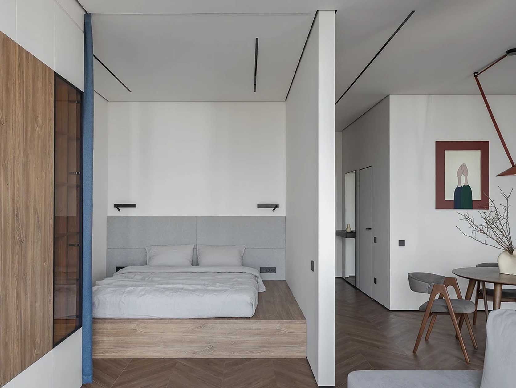 salon et espace chambre sur estrade grand studio 47m2 avec dressing décoration contemporaine