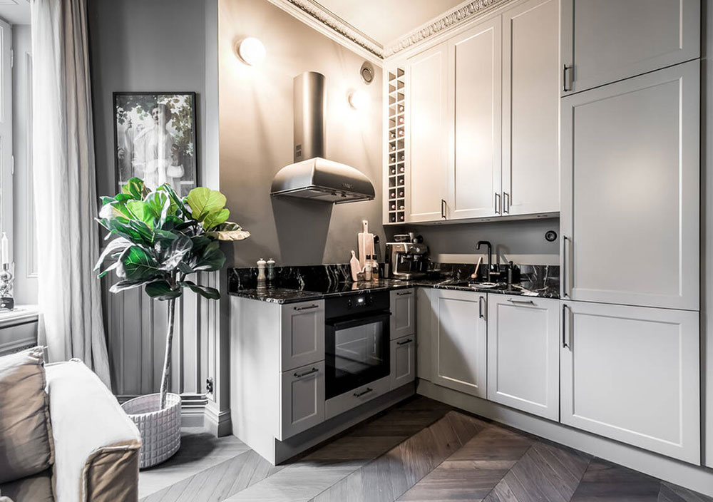 cuisine ouverte dans salon avec moulures anciennes décoration grise scandinave et contemporaine deux-pièces 39m2 cuisine ouverte dans salon avec moulures anciennes décoration grise scandinave et contemporaine deux-pièces 39m2