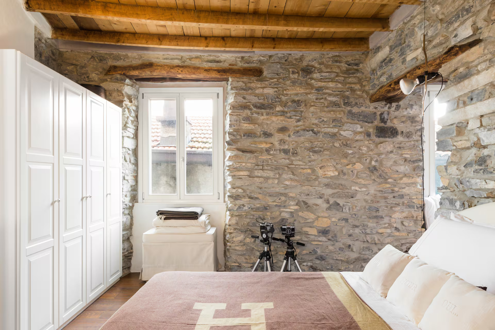 bedroom grey stone walls beams apartment Lake Como rustic chic decor bedroom grey stone walls beams apartment Lake Como rustic chic decor