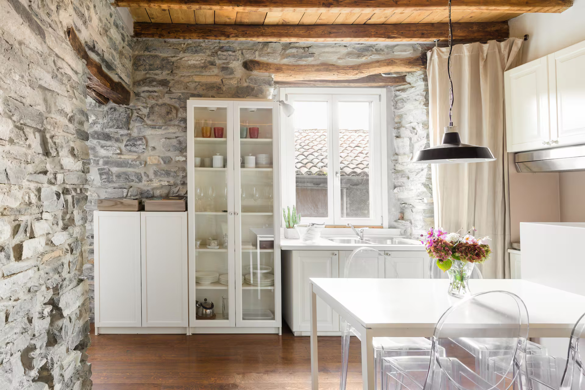 dining room and kitchen grey stone walls beams apartment Lake Como rustic chic decor dining room and kitchen grey stone walls beams apartment Lake Como rustic chic decor