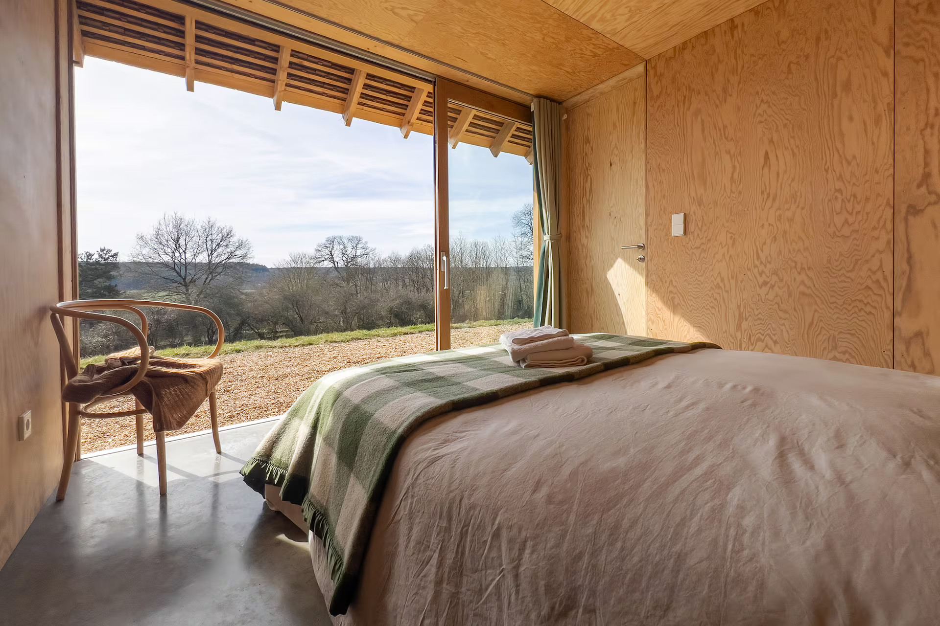 bedroom wood walls bay window