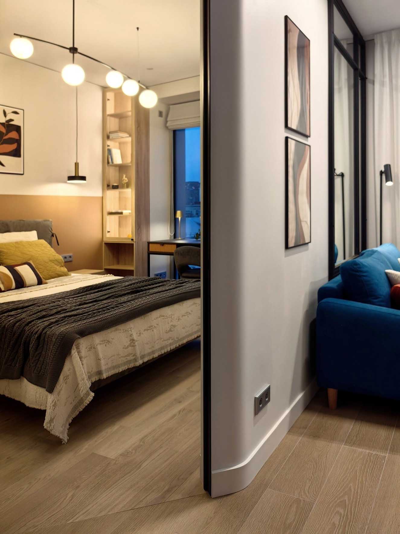 salon avec canapé bleu et chambre décoration contemporaine deux-pièces 34m2