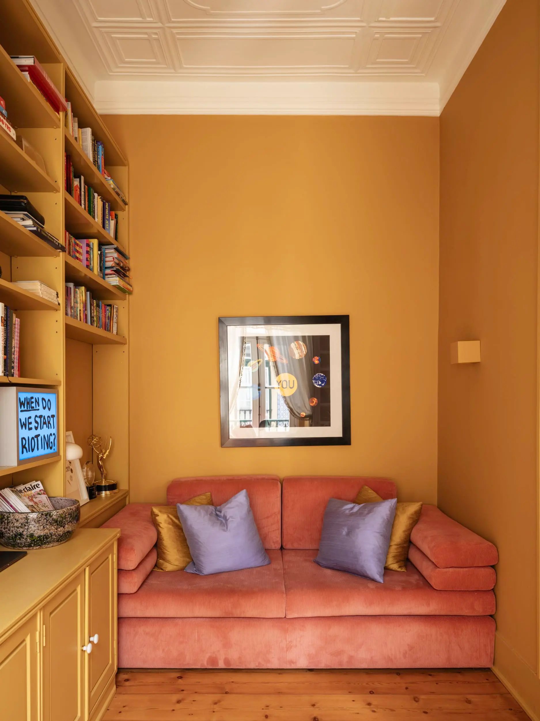 living room with yellow bookcase vintage apartment in Lisbon with refreshing garden living room with yellow bookcase vintage apartment in Lisbon with refreshing garden