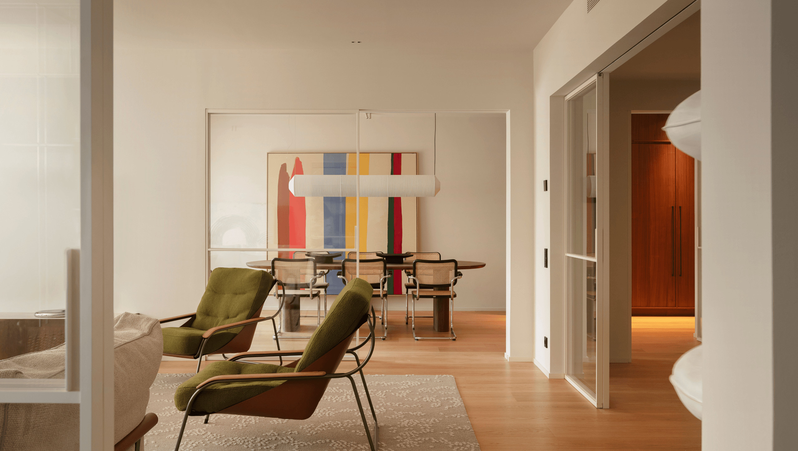 living room and dining room with black Cesca chairs contemporary decor apartment in Barcelona by The Room Studio