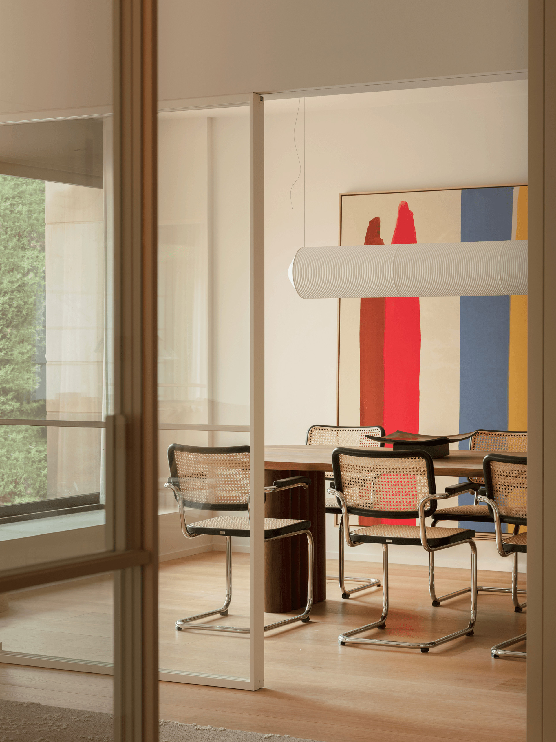 dining room with black Cesca chairs contemporary decor apartment in Barcelona by The Room Studio