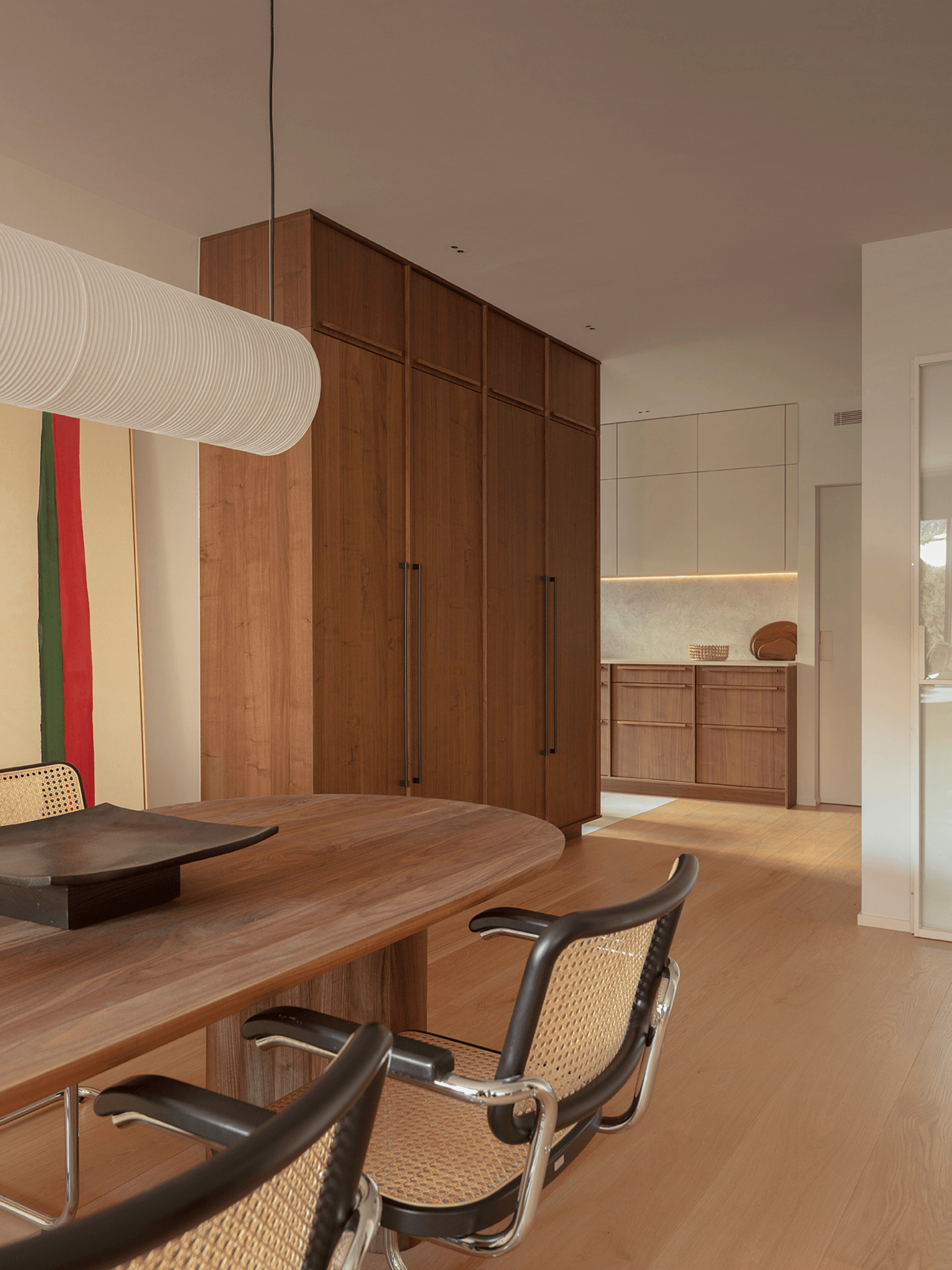 kitchen and dining room with black Cesca chairs contemporary decor apartment in Barcelona by The Room Studio