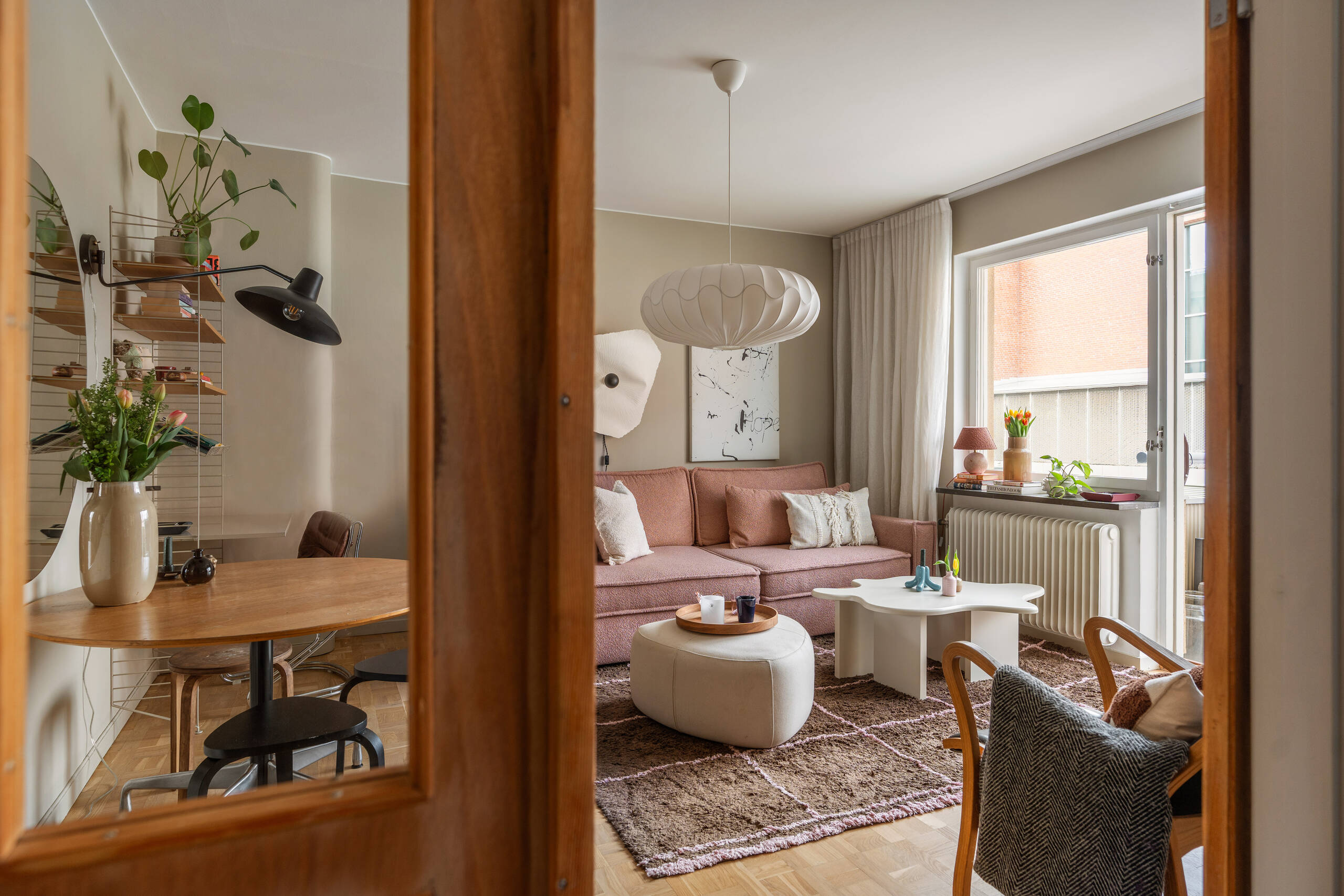 living room with pink sofa scandinavian decor 1950s apartment