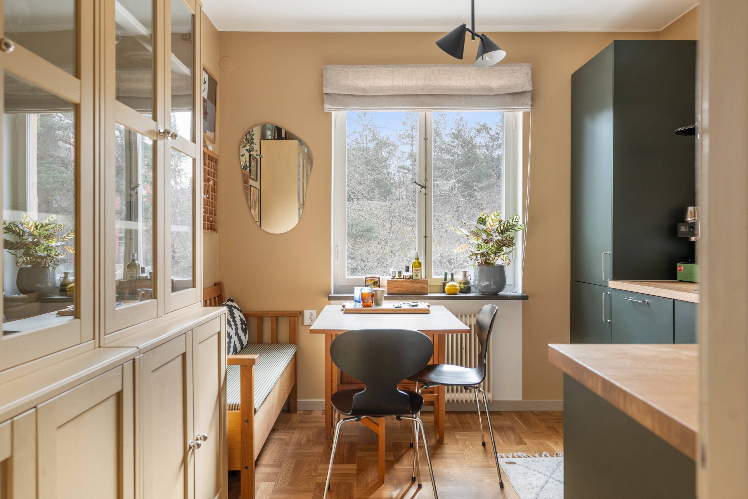 green kitchen with dining room