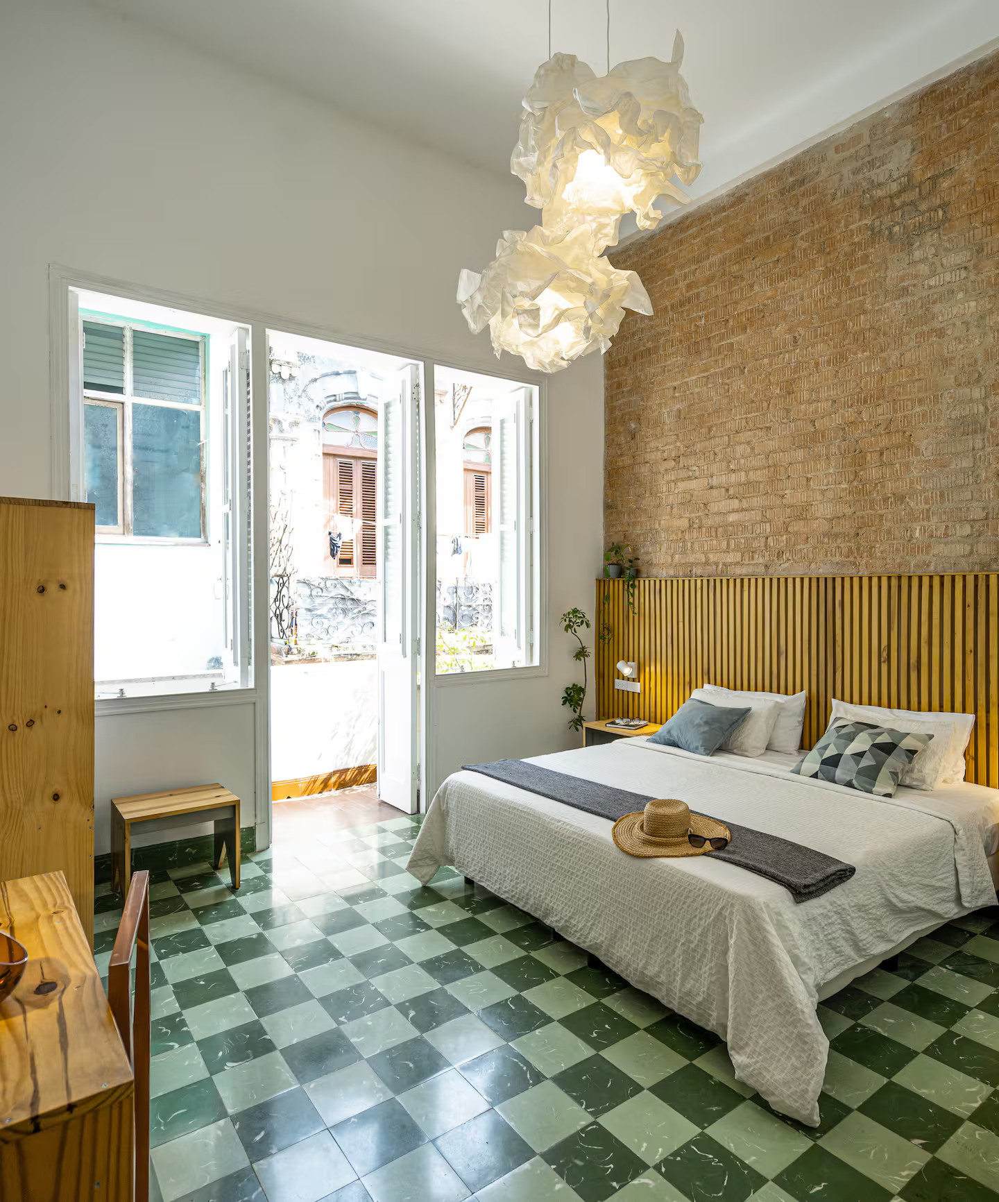 bedroom with bricks wall apartment with patio in the heart of Havana