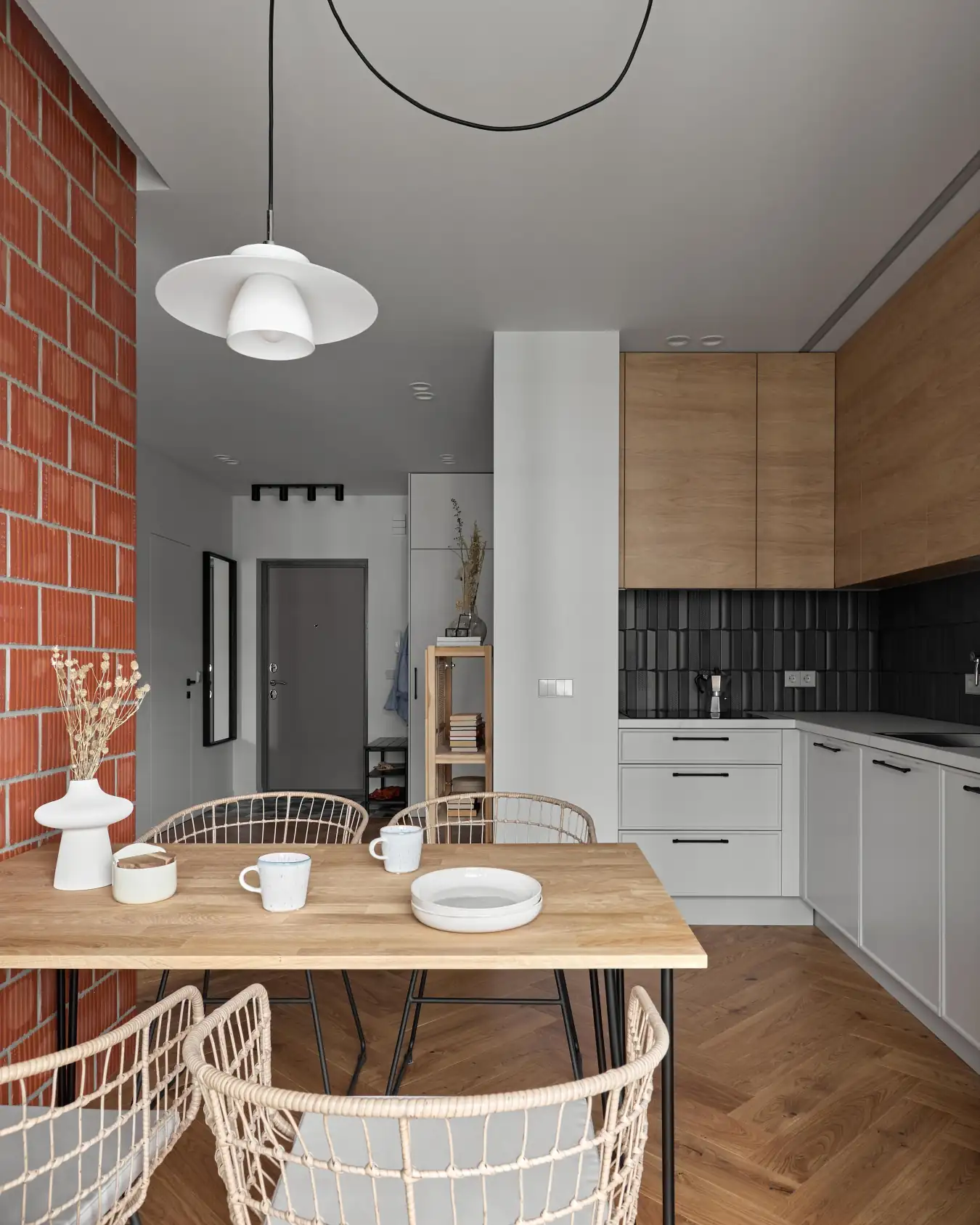 kitchen and living room with brick wall small modern apartment with IKEA furniture