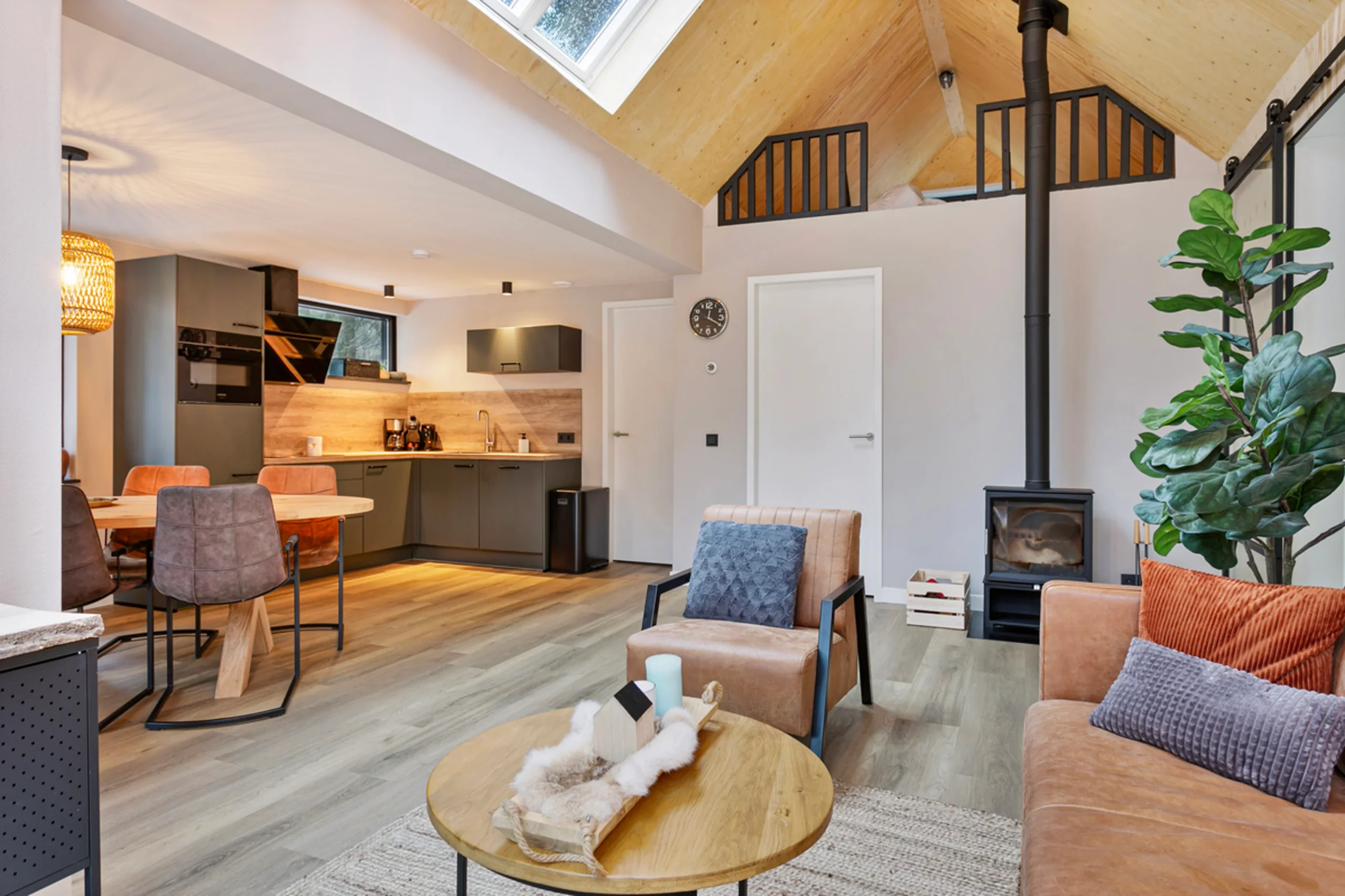 living room with double-height ceiling and mezzanine modern wooden house with lush garden Netherlands living room with double-height ceiling and mezzanine modern wooden house with lush garden Netherlands