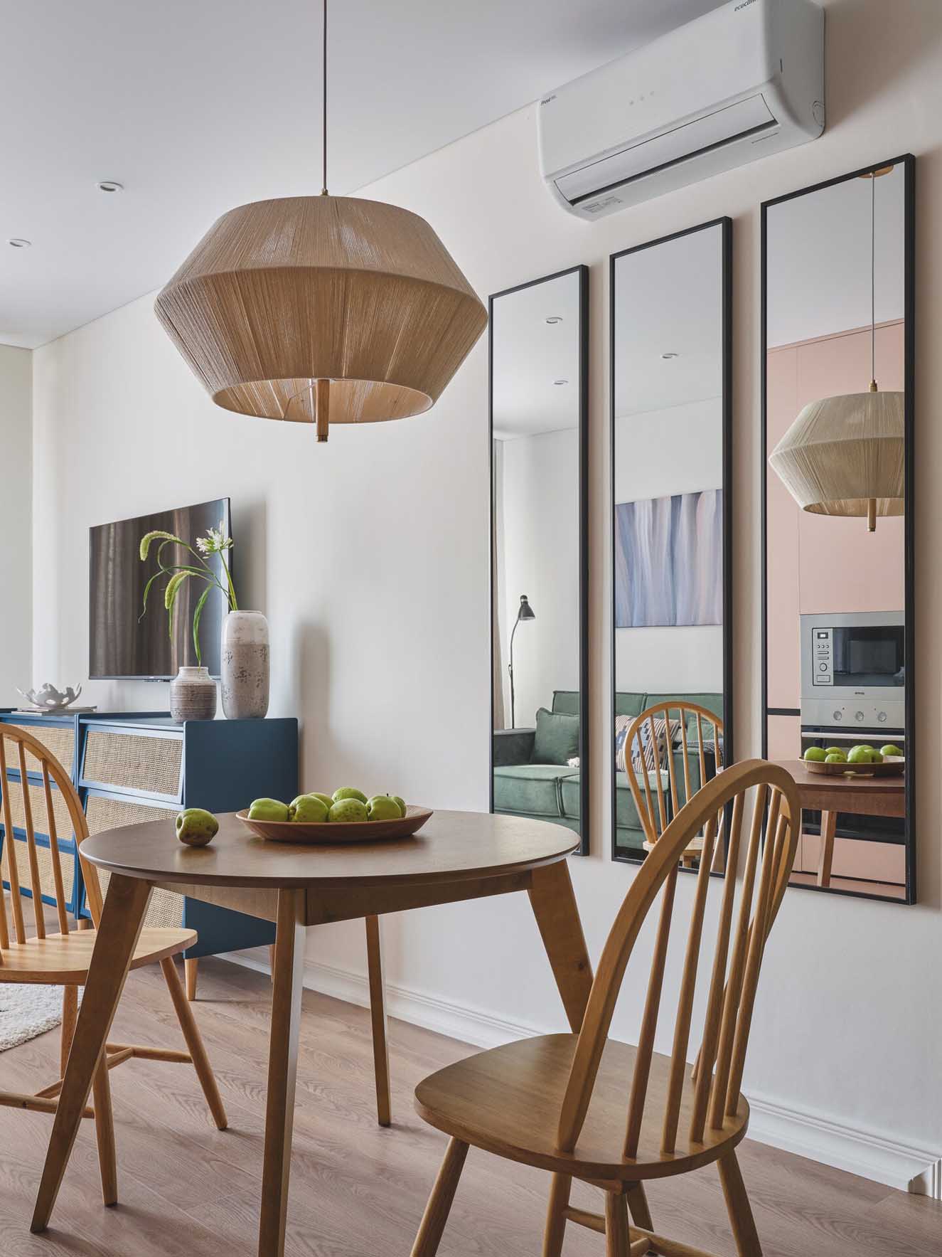 pink kitchen dining room and living room with green sofa in a two-room 42sqm apartment pink kitchen dining room and living room with green sofa in a two-room 42sqm apartment