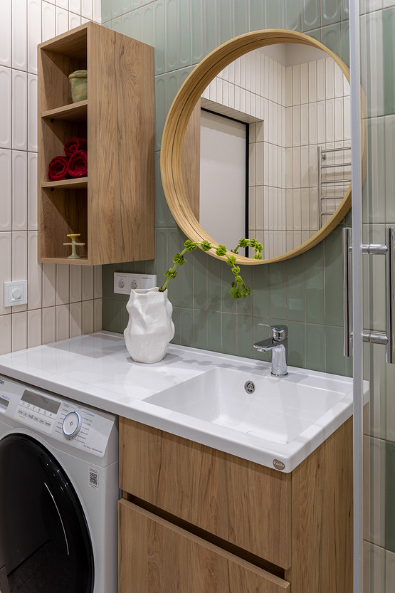 green and wood bathroom with laundry