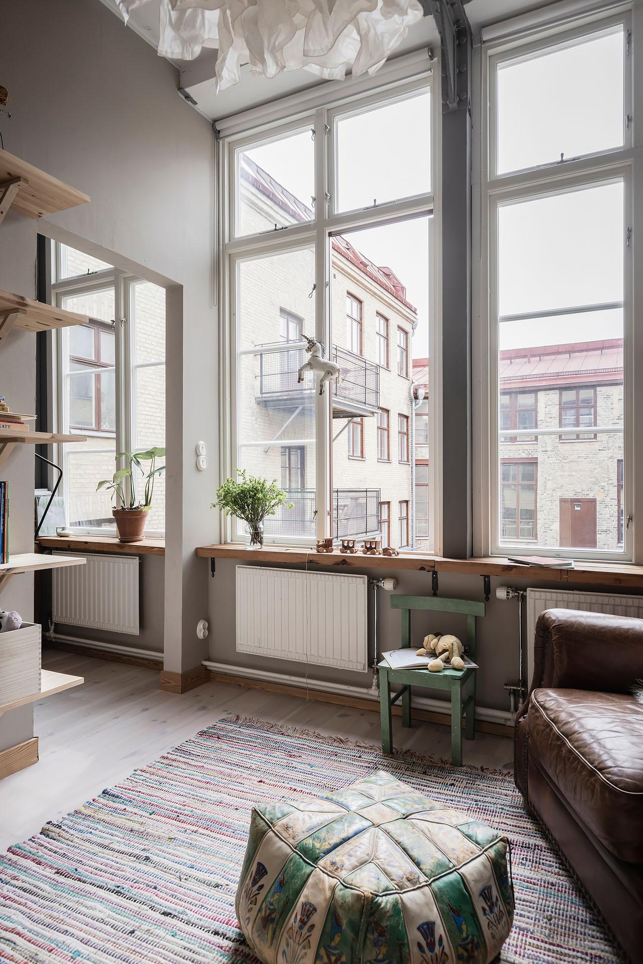 salon avec fauteuil club appartement 80m2 décoration scandinave