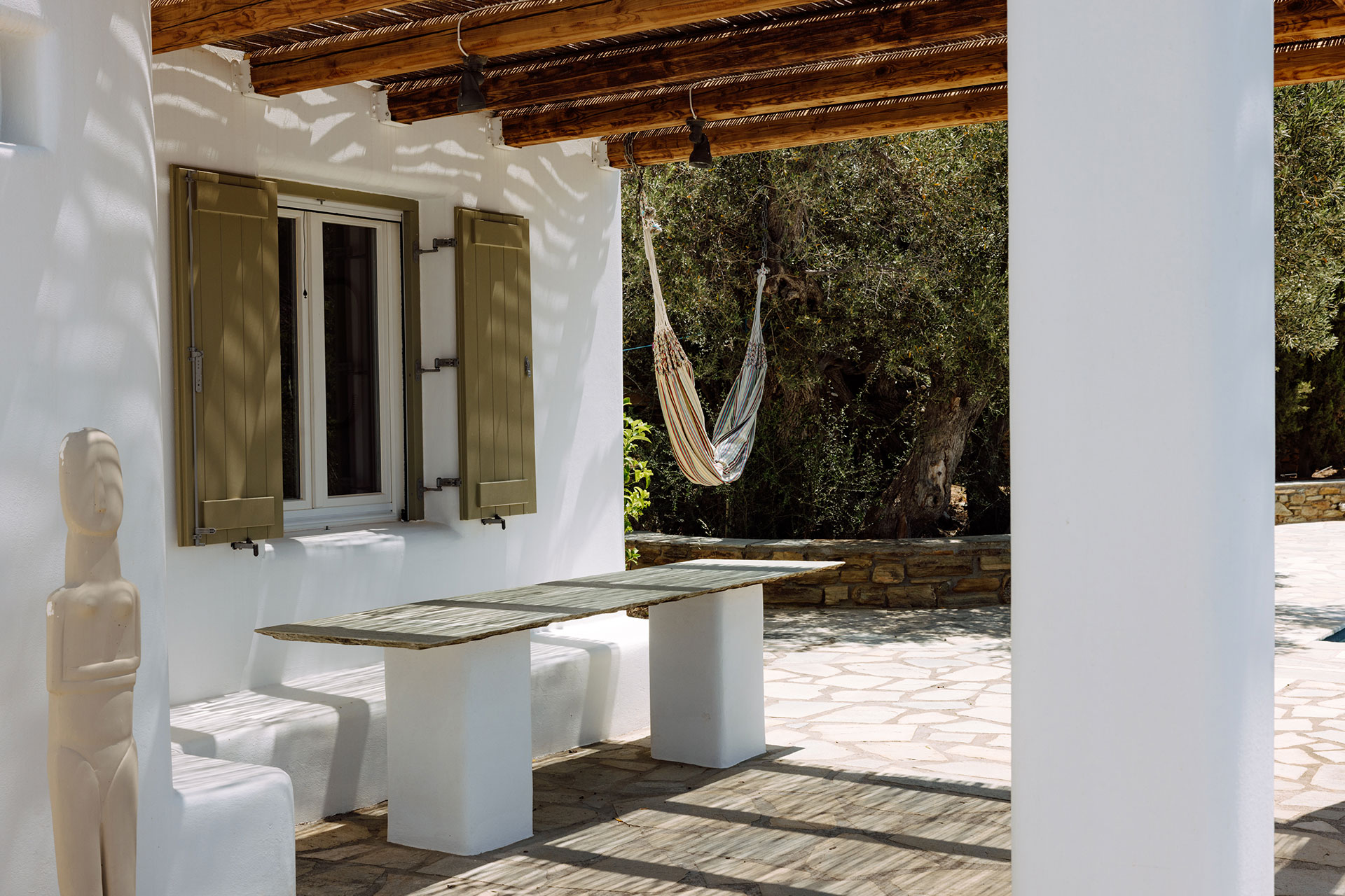 terrace with pergola minimalist house with pool Villa Rizza island of Andros Greece