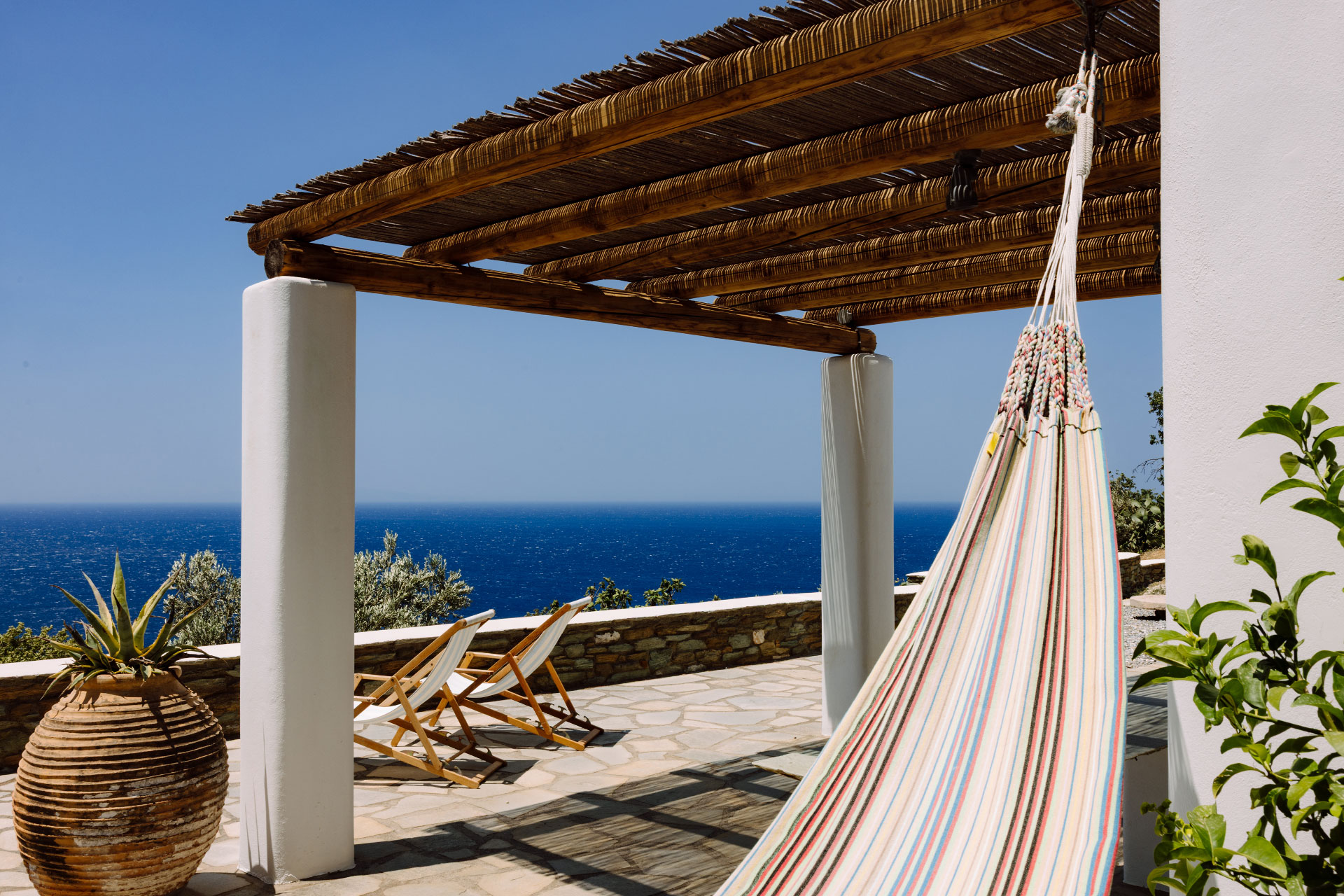 terrace with pergola minimalist house with pool Villa Rizza island of Andros Greece