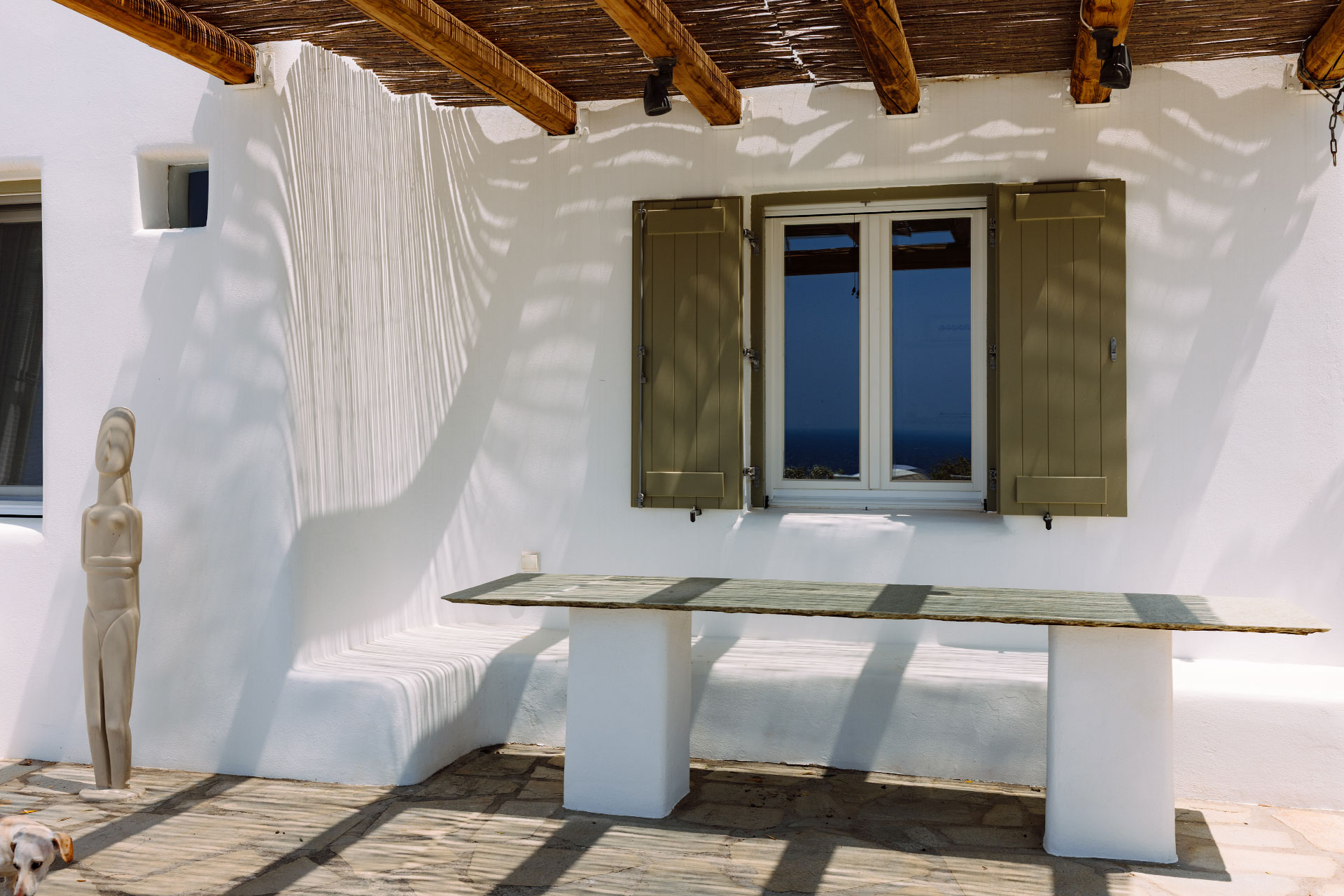 terrace with pergola minimalist house with pool Villa Rizza island of Andros Greece