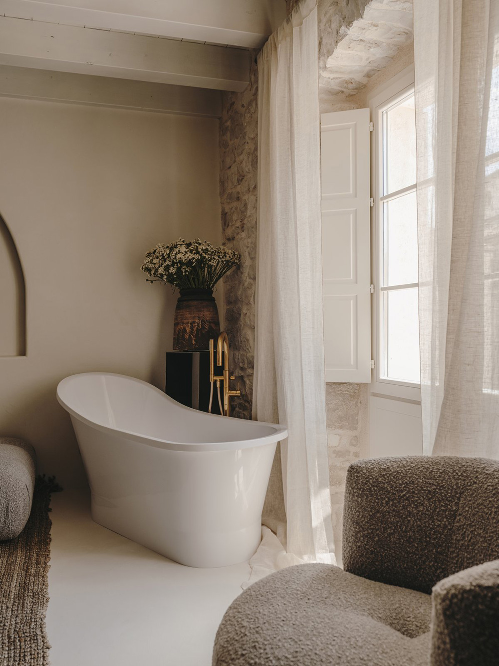 bedroom with stone wall and bathtube Palazzo Caterina Hvar Croatia
