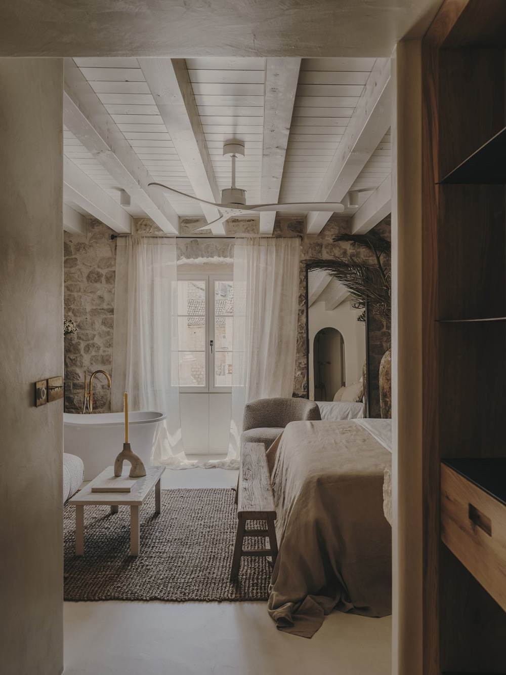 bedroom stone walls with bath beige decor Palazzo Caterina Hvar Croatia19th-century palace