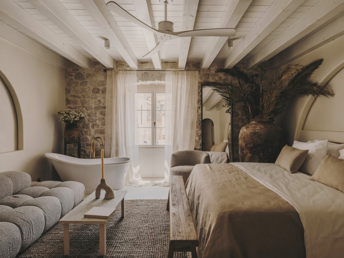 bedroom stone walls with bath beige decor Palazzo Caterina Hvar Croatia19th-century palace