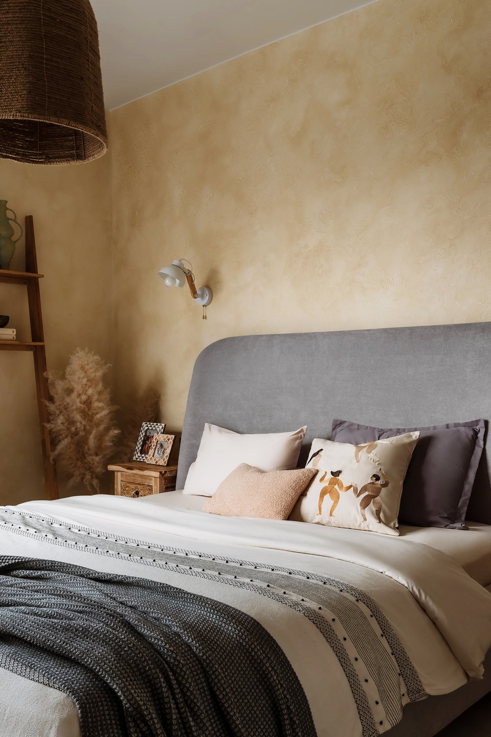modern ethnic bedroom with yellow plastered wall