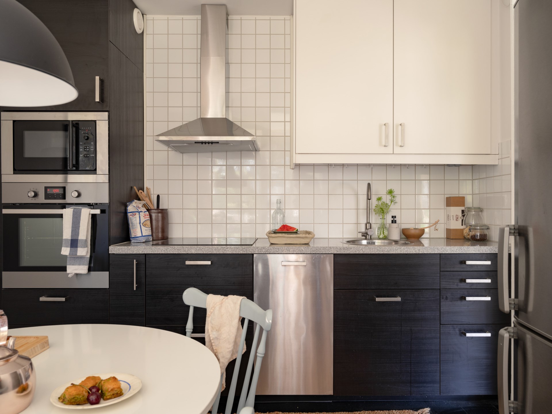 black modern kitchen with dining nook