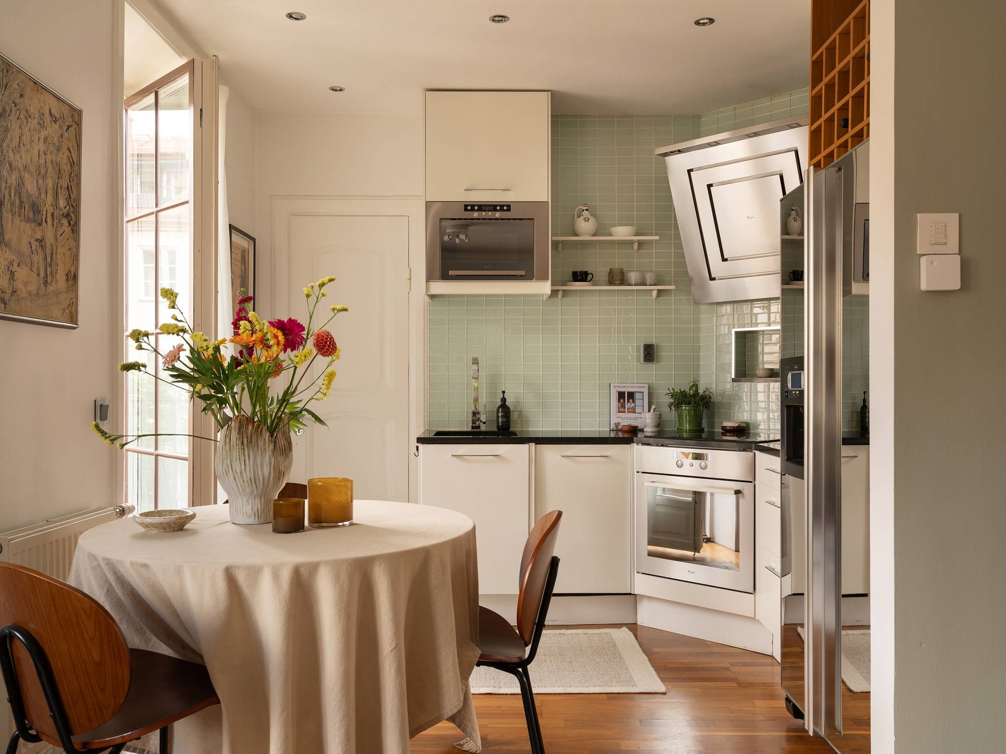 dining room and open kitchen 31sqm studio Scandinavian decor in neutral tons