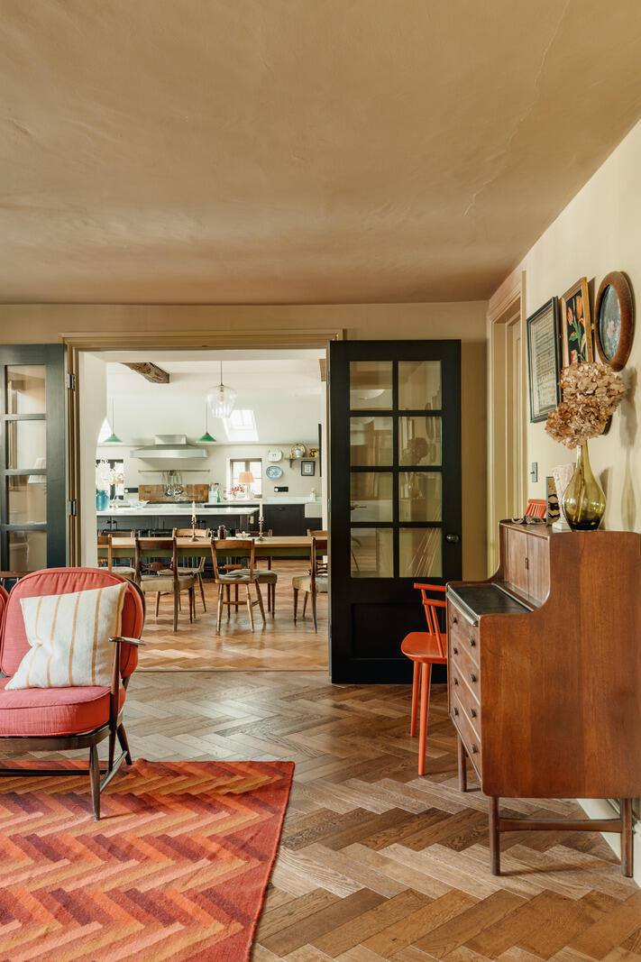 large kitchen with dining room and living room classic chic decor Tudor-style village house