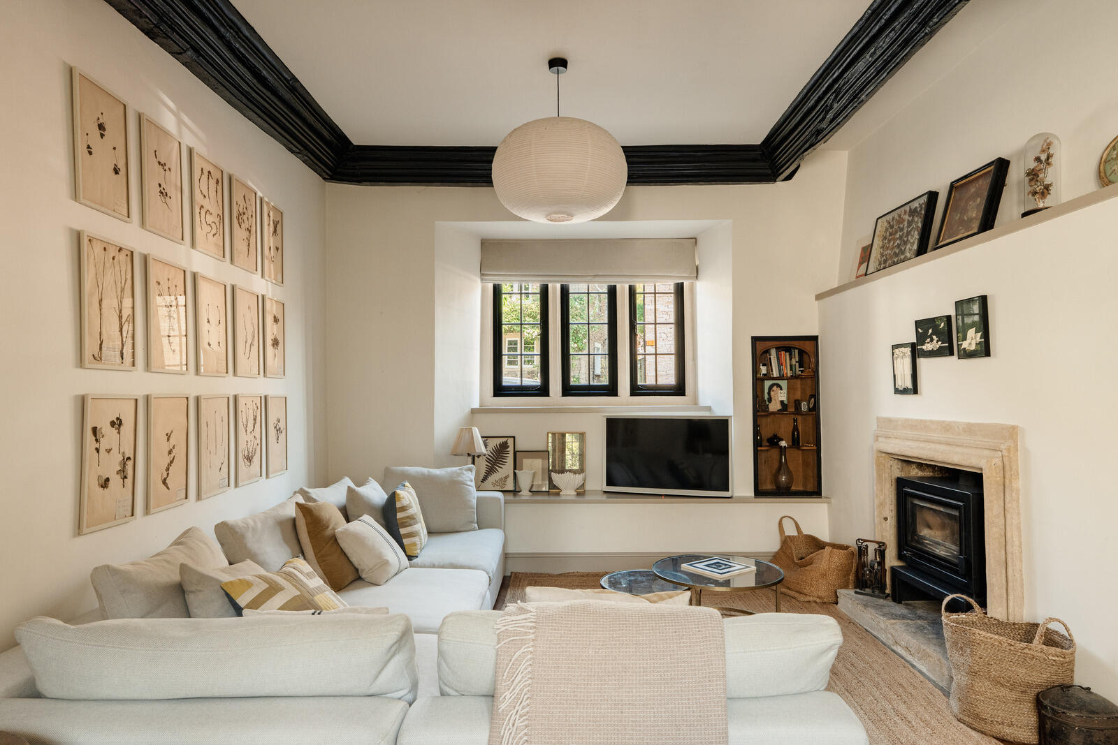 beige living room with fireplace and beams classic chic decor Tudor-style village house