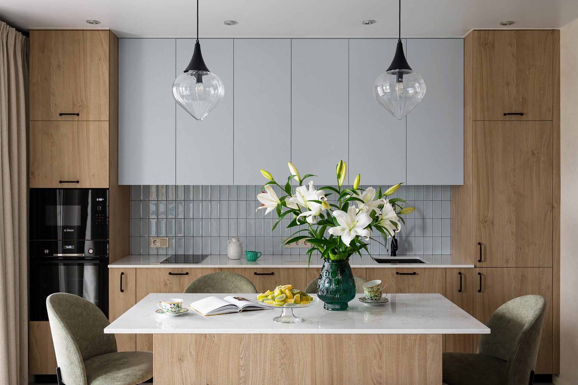 designer open kitchen light blue and wood