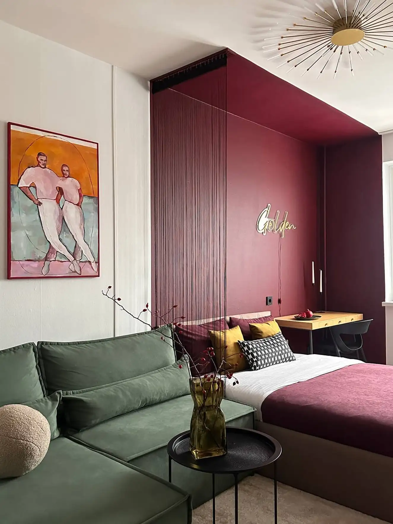 living room and bedroom with colour blocking in green and burgundy 37sqm studio contemporary decor