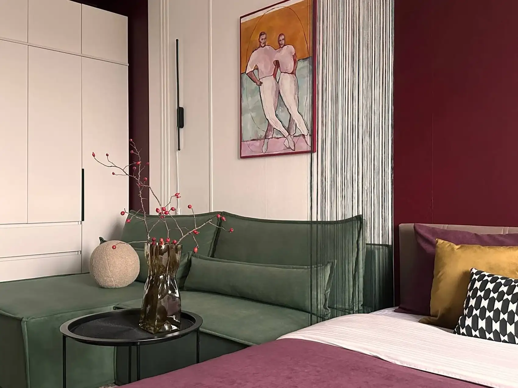 living room and bedroom with colour blocking in green and burgundy 37sqm studio contemporary decor