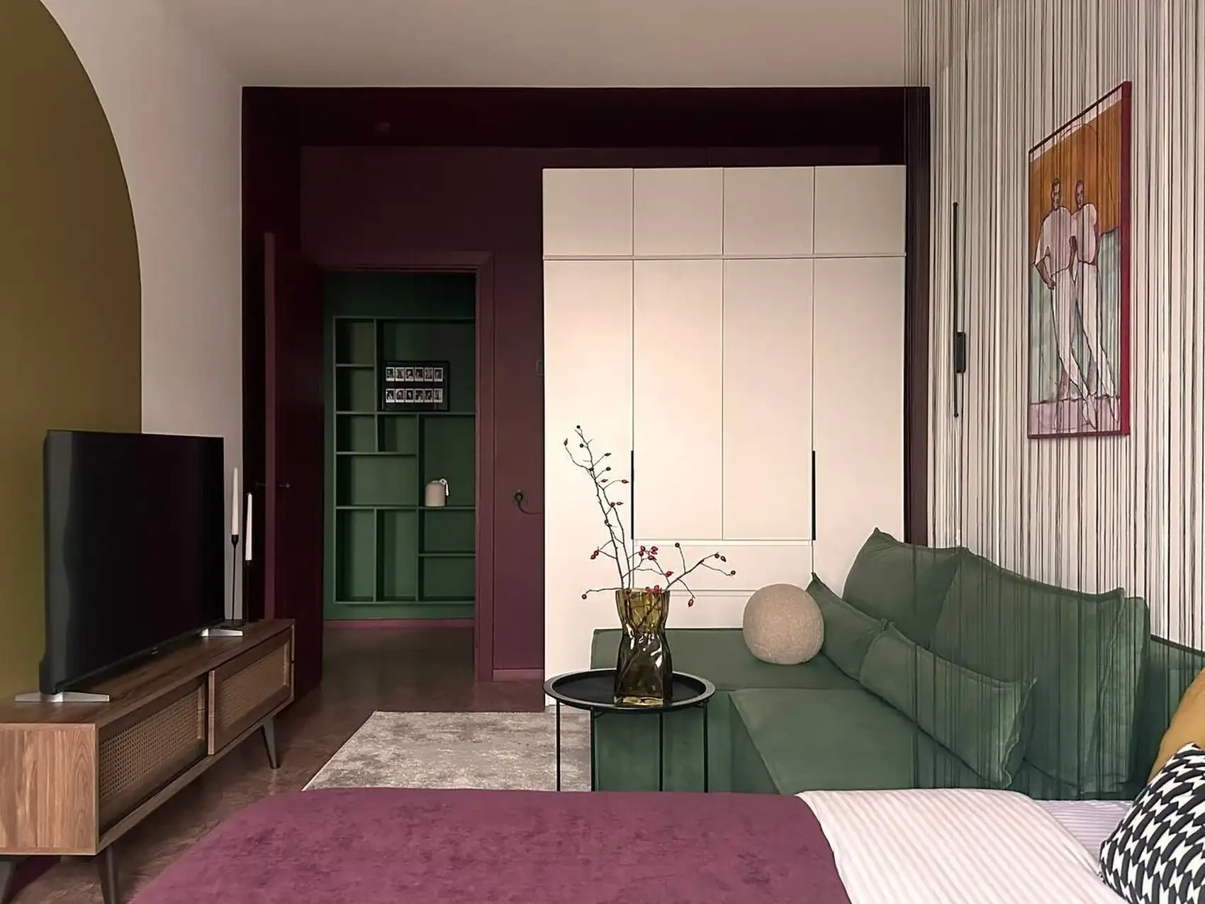 living room and bedroom with colour blocking in green and burgundy 37sqm studio contemporary decor