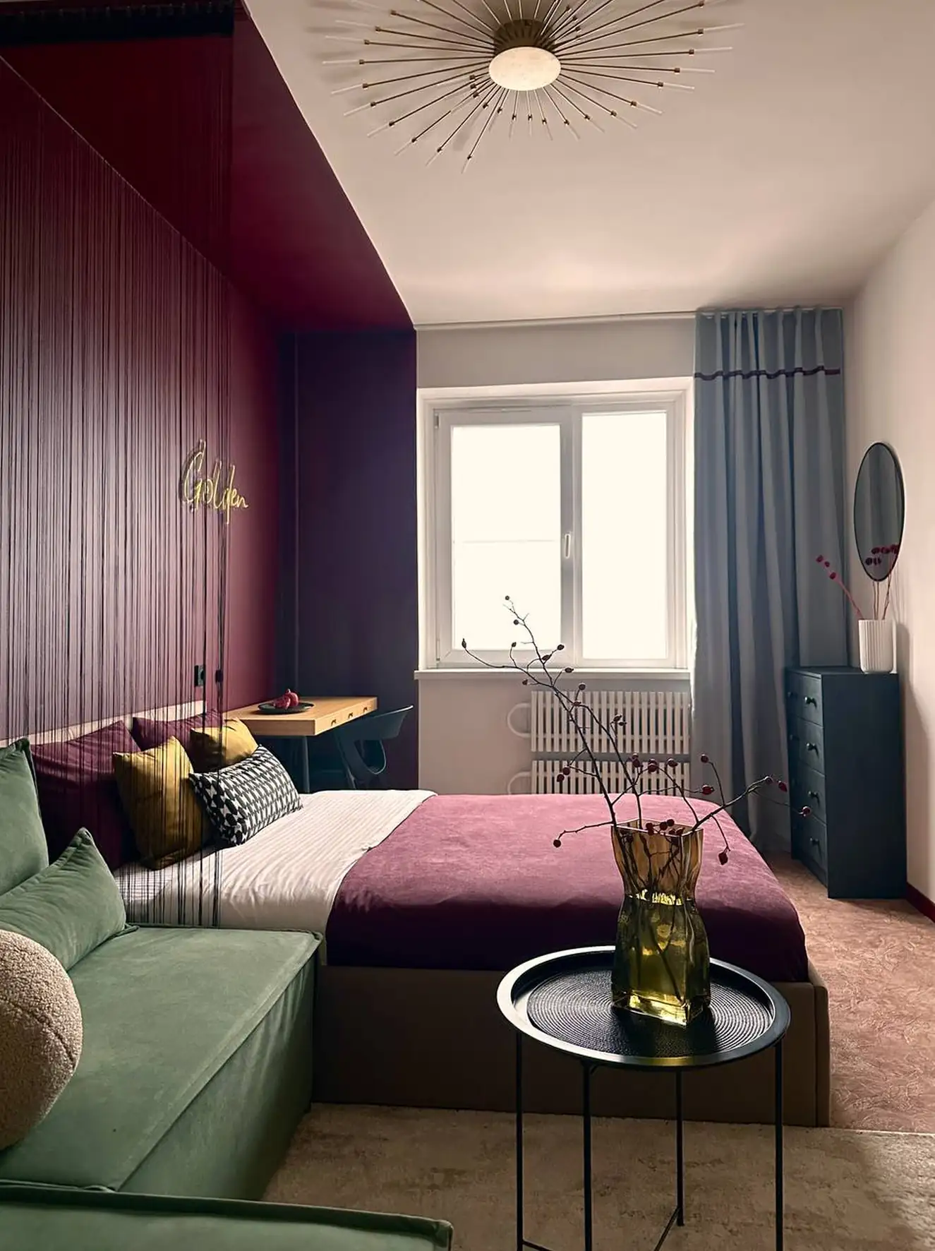 living room and bedroom with colour blocking in green and burgundy 37sqm studio contemporary decor