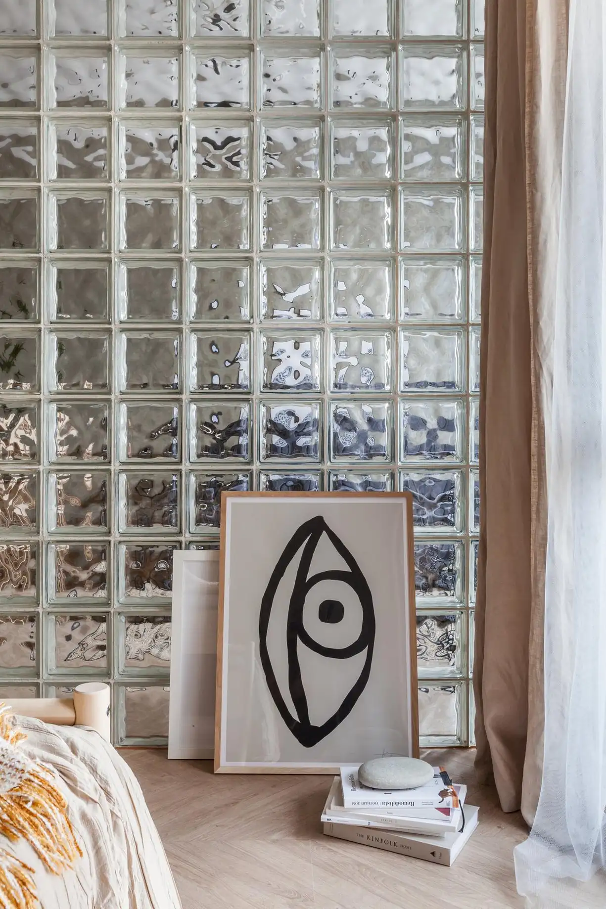 natural bedroom in 45sqm apartment with a glass brick partition