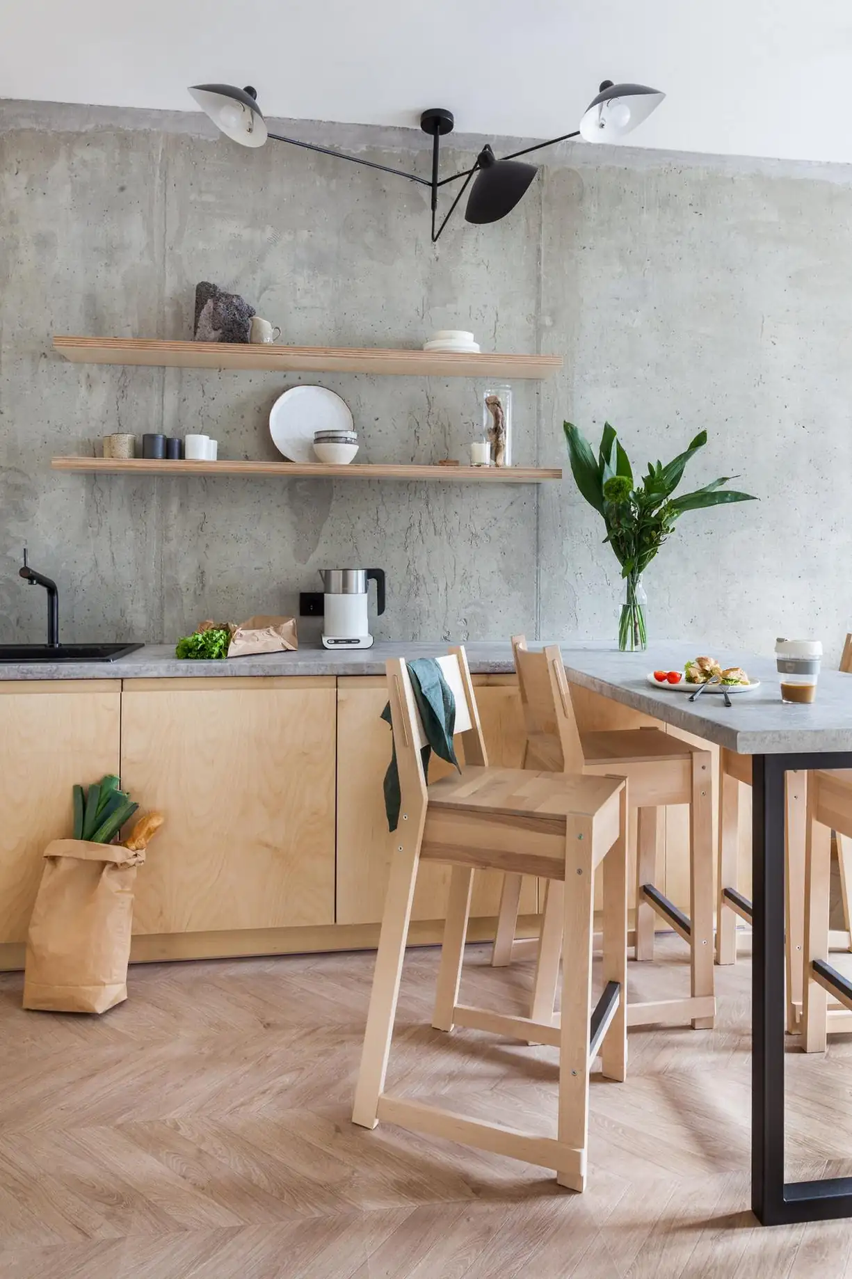 concrete and Plywood modern kitchen in 45sqm apartment with a glass brick partition