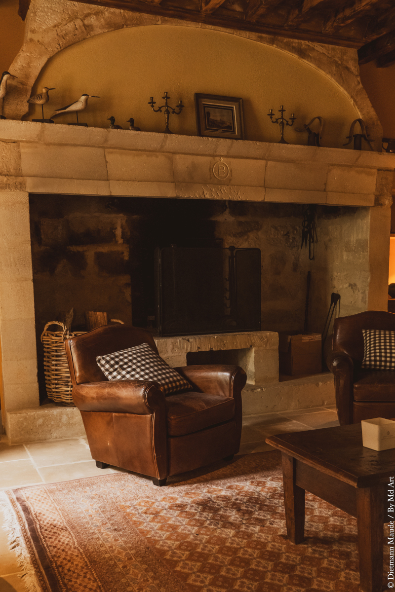 living room with beams and stone historic fireplace Provence