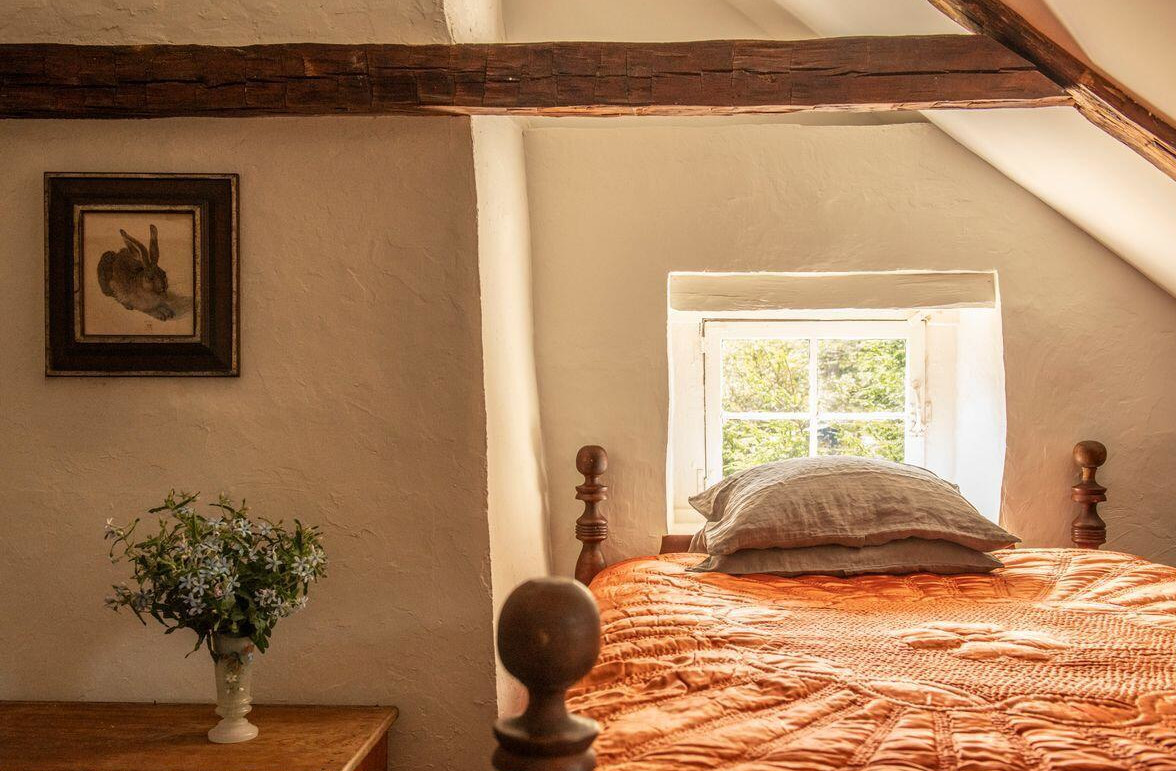attic bedroom with beams