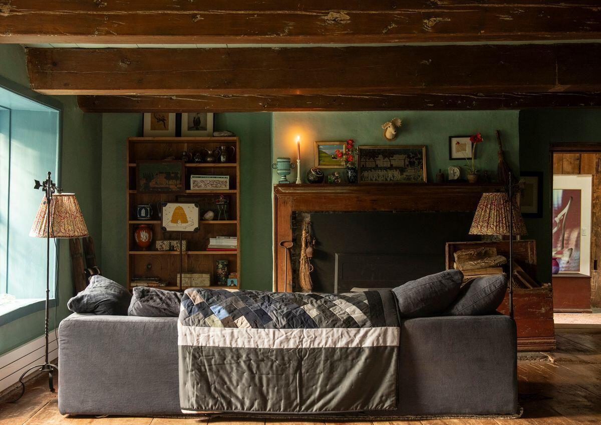 green living room with a fireplace rustic chic decor 18th-century house in the Catskills